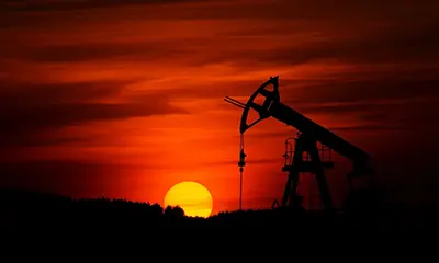 Oil rig at sunset