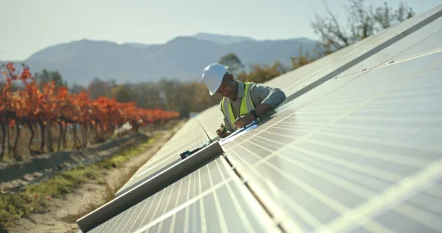 Man installing solar panels