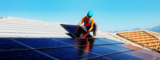 Man installing solar panels
