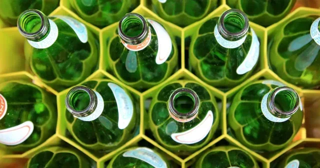 Aerial view of empty glass bottles in a crate