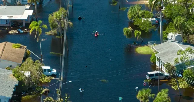 Flood waters from Hurricane Ian flood homes in a Florida residential area. Getty Images.