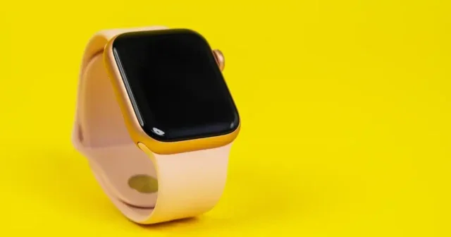 pple Watch Series 6 with pink rubber strap on yellow background